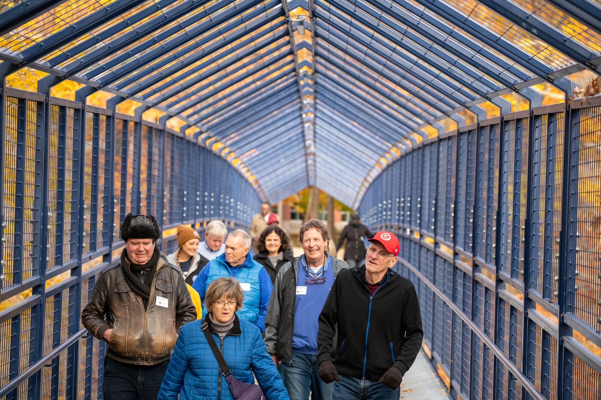 Alumni walking on Little Mac Bridge